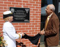 Rear Adm. Cindy Covell and Alton Adams Jr. unveil plaque naming a Navy band building for Alton Adams Sr. Rear Adm. Cindy Covell and Alton Adams Jr. unveil plaque naming a Navy band building for Alton Adams Sr.